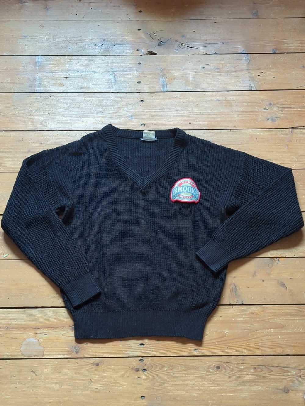 274- Vintage Brooks Black V-Neck Sweater with Red Logo Patch